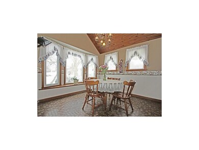 Formal dining room with bay window and vaulted ton