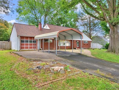 Ranch-style house featuring a carport and a front