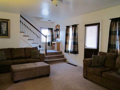 Living Room. From the enclosed front sun room you 