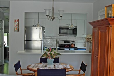 The opened kitchen changes the entire feel to an open concept.