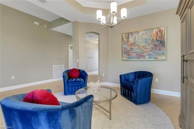 Living area with light tile patterned floors, visi
