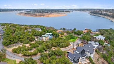 Aerial view of property's location with nearby suburban area and a large body of water