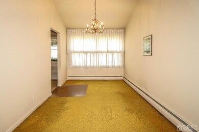 Cheery Formal Dining room located next to kitchen, makes it easy for serving meals.