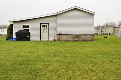 Rear of home, man door from garage.