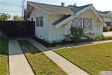 Gated R/V parking on side of home with paved drive