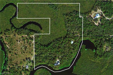 Overview aerial view of home and outbuildings, and
