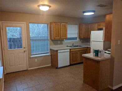 Kitchen with sink and white appliances