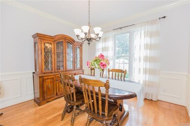 Formal dining with hardwood floors and decorative 