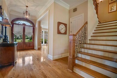 Elegant entry - volume ceilings, custom millwork &