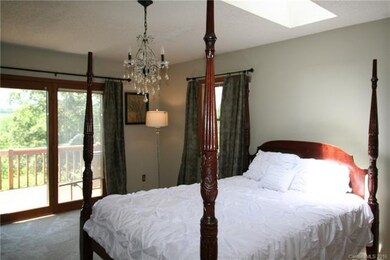 master bedroom/skylight/French doors to deck/views
