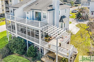 Easy Island living with screen porch off living room, deck off master suite, pergola covered deck and patio below.