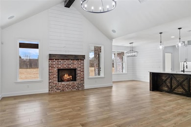 Unfurnished living room featuring a fireplace, a n