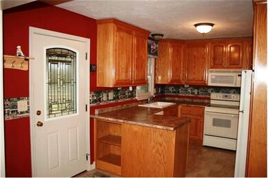 ONE VIEW OF THE KITCHEN AND NEW ENTRY DOOR NOTICE 