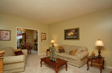 Living room.  2014 all new carpet throughout!