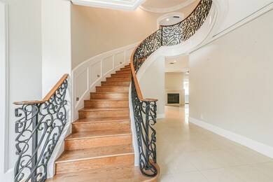 Enter through double doors to soaring ceilings and