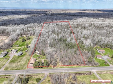 Aerial view of property and surrounding area with 