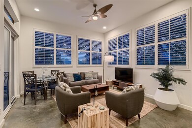 Living area featuring concrete flooring, a ceilin