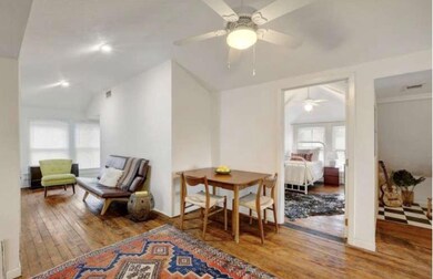 Living area with ceiling fan, lofted ceiling, ple