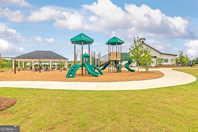 Community playground featuring a lawn and a gazebo