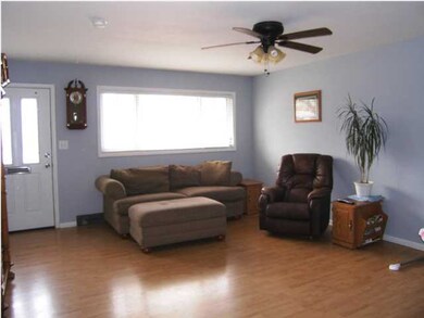 AN ALTERNATE VIEW OF THE LIVING ROOM FROM THE KITC