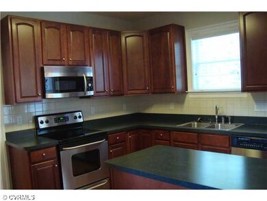 Kitchen - The kitchen has beautiful wood cabinets 