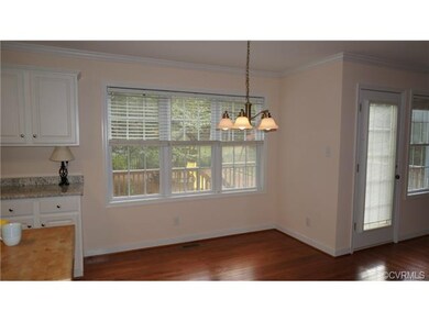 Comfortable breakfast nook looks out onto the deck