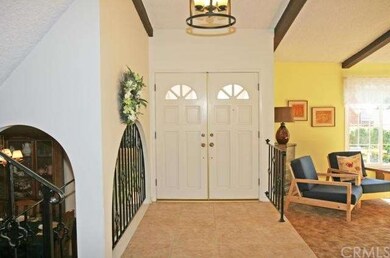 Double door entry, designer tile foyer, wrought ir