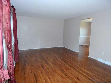 Living Room. Gleaming hardwood floors, neutral wal