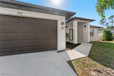 View of front of property with a front yard and a