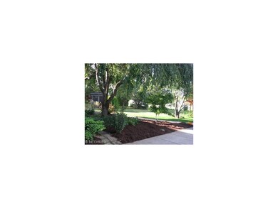 Gazebo at side of lot and plantings along the way.