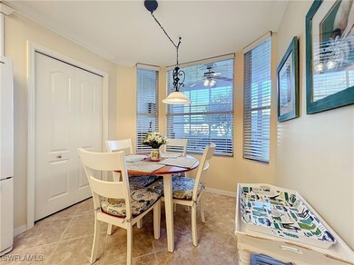 Dining room with light tile patterned flooring