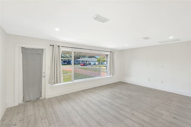 Unfurnished room featuring recessed lighting and light wood finished floors
