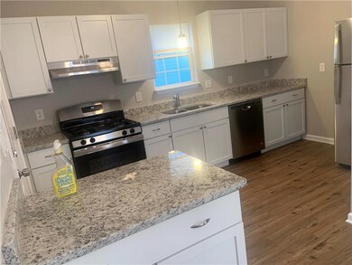 Updated kitchen with quartz counters and stainless steel appliances