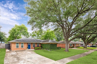 This home features a beautifully landscaped front