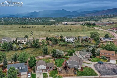 Aerial, huge corner lot, with open space behind