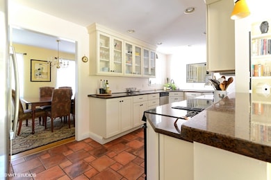Recessed lighting, glass faced cabinetry, ceramic