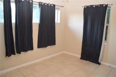Bedroom 2 offers tile floors and closet.