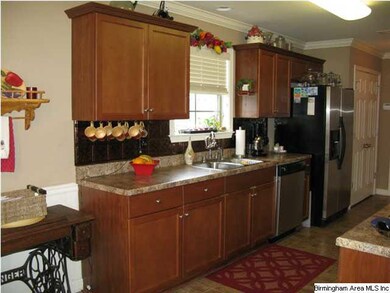 Gallery style kitchen with all stainless appliance