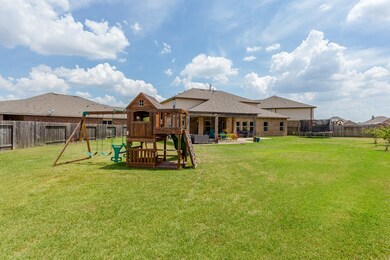 The Back Yard flows beautifully off the patio inviting you to enjoy the lush green space that can be easily maintained and well enjoyed.