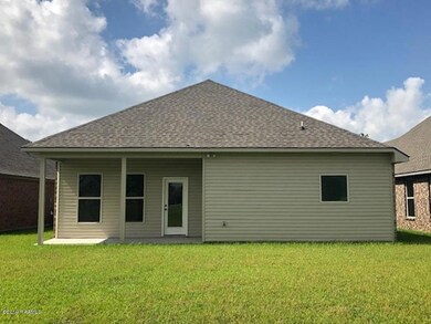 BACK VIEW WITH COVERED PATIO