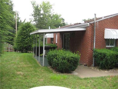 Exterior Back. Back patio. Concrete sidewalk from 