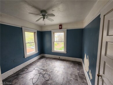 Unfurnished room featuring a healthy amount of sunlight, ceiling fan, and tile floors