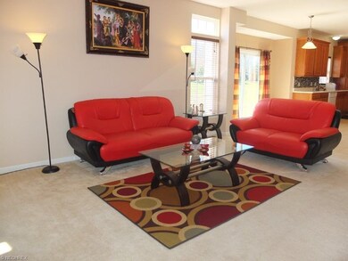 Living room is open to dinette and kitchen.