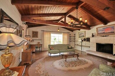 Grand formal living room with limestone fireplace