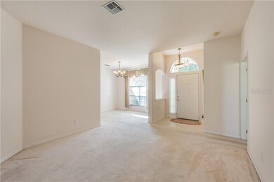 Living and adjoining formal dining rooms are well 