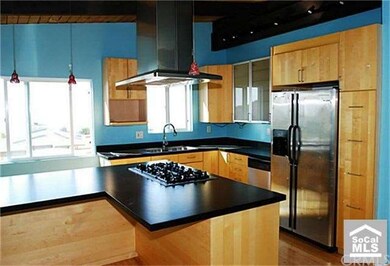 Gourmet kitchen with large center island with cook