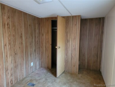 Unfurnished bedroom with a closet and light colore