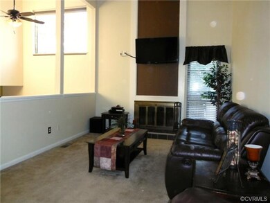 Family Room: Vaulted with exposed beams, wood burn