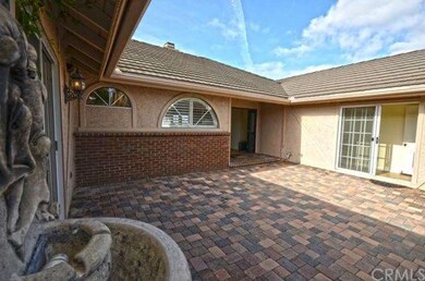 Proceed through gated courtyard to double doors to