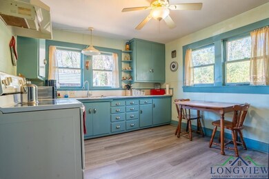 Kitchen featuring electric stove, light wood-type 